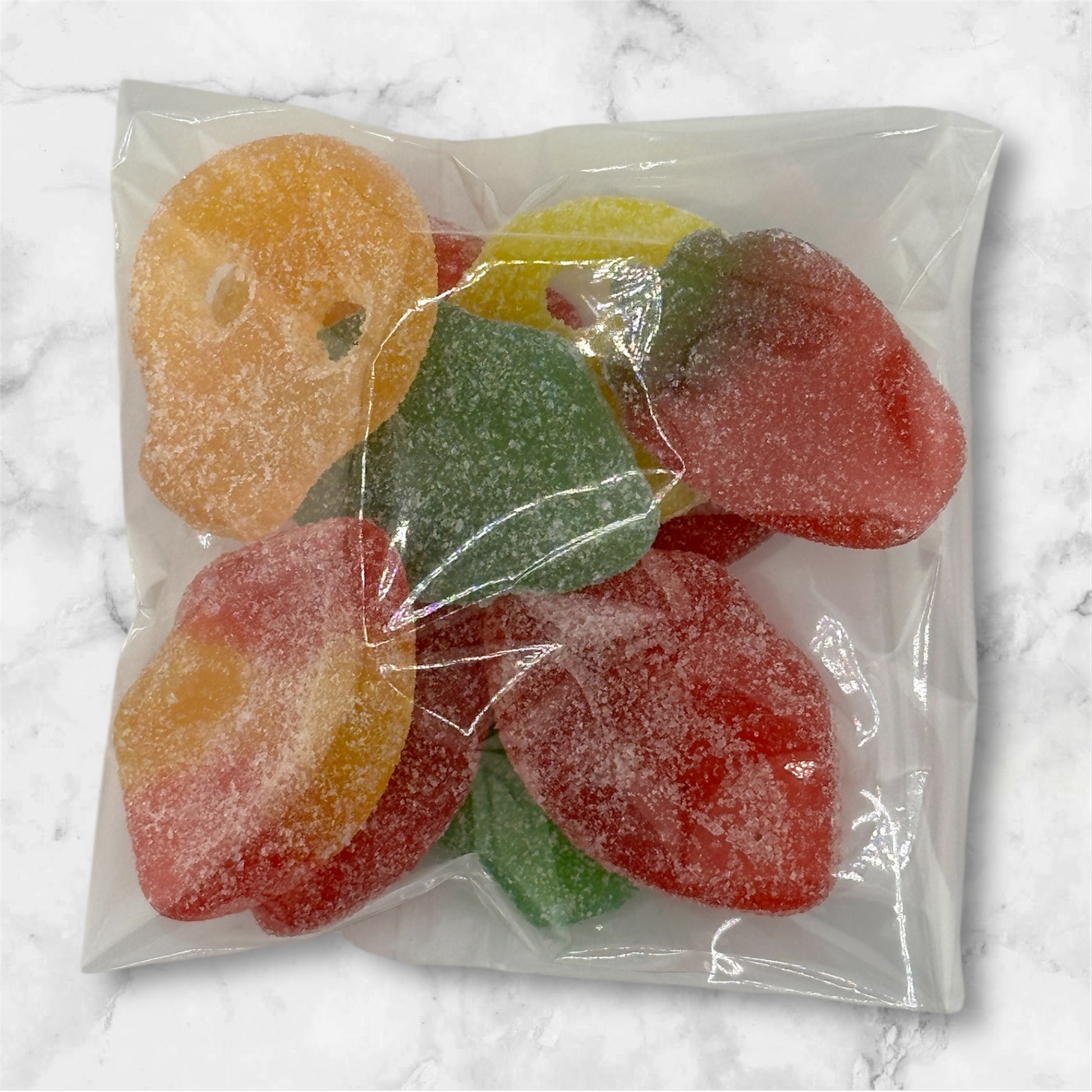 photo showing brightly colored swedish candy sour skulls and lips on a tray